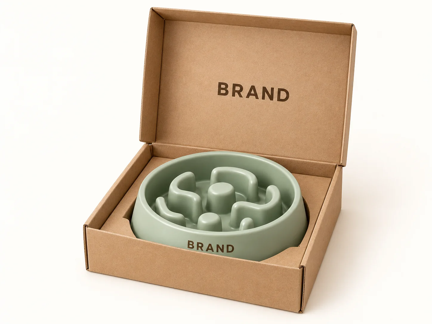 Sage-green slow-feeder bowl inside an open kraft sample box